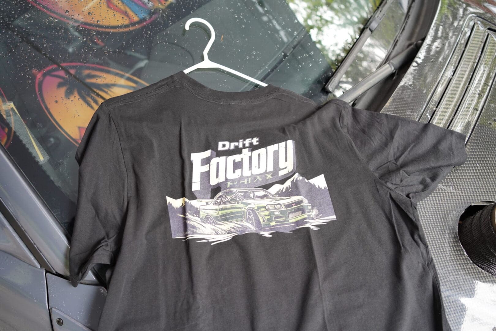 A black shirt with the words " grey factory ".