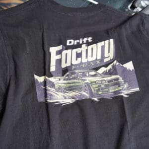 A black shirt with the words drift factory printed on it.