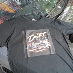 A black shirt with a picture of a car on it.