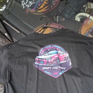 A close up of the back of a shirt with a car on it