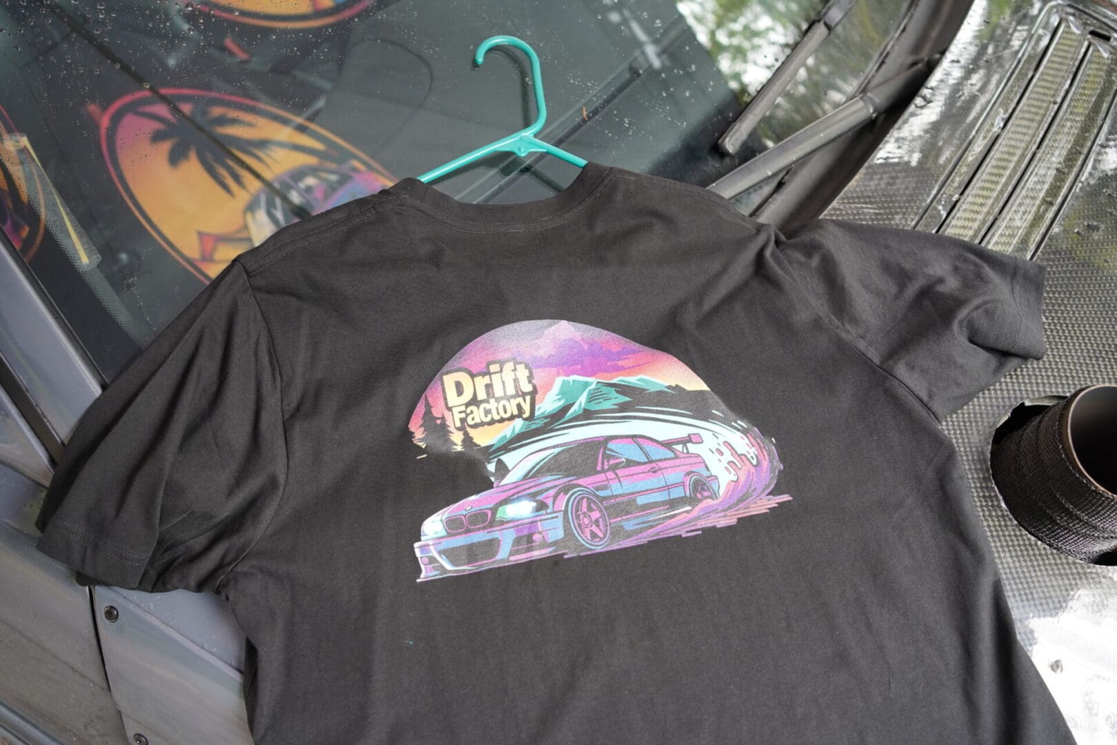 A black shirt with a car on it