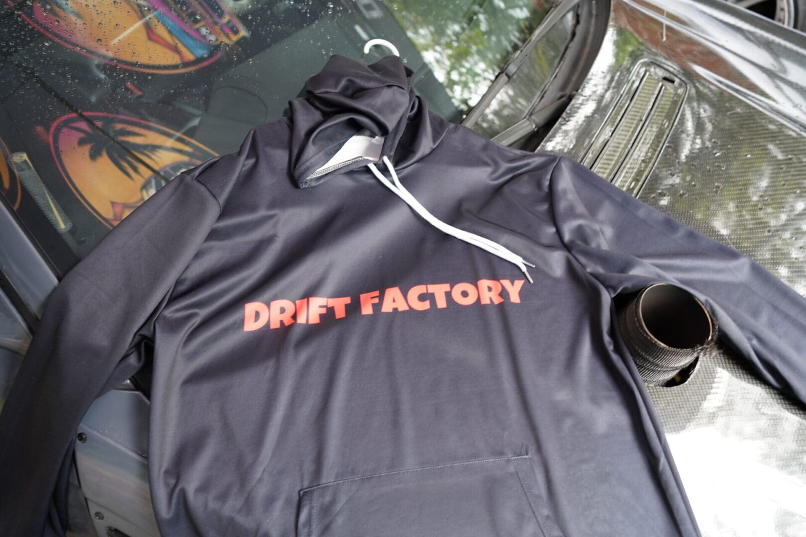 A black hoodie with the words drift factory on it.